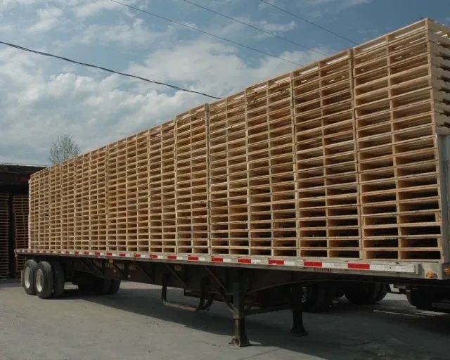 A truck loaded with pallets